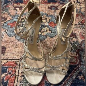 Jimmy Choo strappy crystal heels in a champagne / nude satin finish.